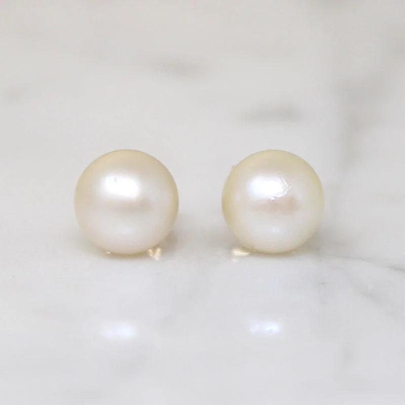 Statement Earrings for Special Occasions-Delicate 8.6mm White Pearl & Gold Stud Earrings